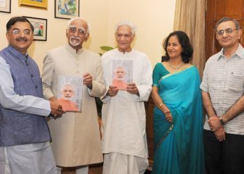 The Vice President of India Shri M. Hamid Ansari receiving a book entitled 'Modi - Incredible emergence of a star" in Chinese language written by Shri Tarun Vijay, Member of Parliament (Rajya Sabha), in New Delhi on June 16, 2015.