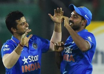 Indian cricketer Suresh Raina (L) celebrates with teammate Dhawal Kulkarni after the dismissal of Bangladesh cricketer Shakib Al Hasan during the third ODI (One Day International) cricket match between Bangladesh and India at the Sher-e-Bangla National Cricket Stadium in Dhaka on June 24, 2015. AFP PHOTO/Munir uz ZAMAN        (Photo credit should read MUNIR UZ ZAMAN/AFP/Getty Images)