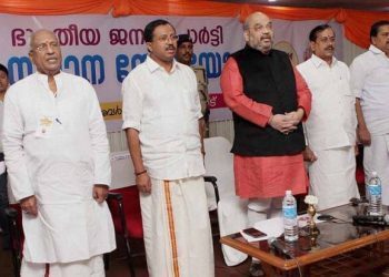Palakkad : BJP national president Amit Shah with party leaders at a party meeting at Palakkad in Kerala on Friday. PTI Photo (PTI12_19_2014_000042B)