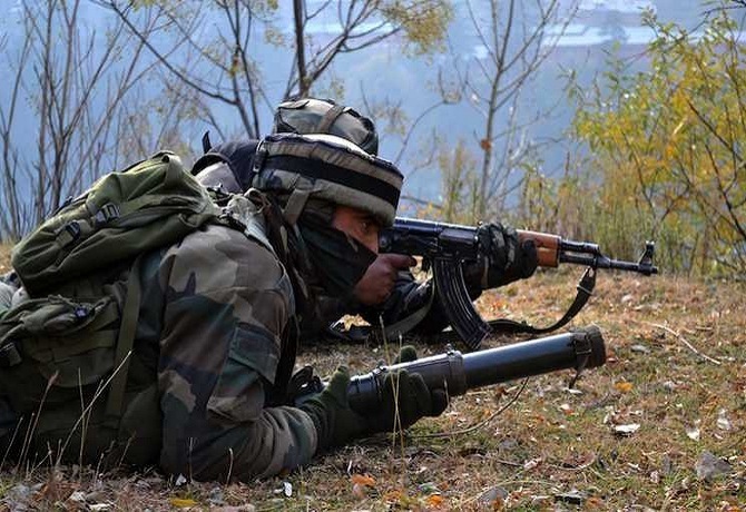 Baramulla: Soldiers take position during an encounter with heavily-armed militants who  mounted an audacious attack on Indian Army's Field Ordinance Camp at Mohra near the border town of Uri in Baramulla district of Jammu and Kashmir on Dec 5, 2014. (Photo: IANS)