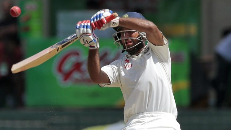 India's Cheteshwar Pujara plays a shot on the third day of their third test cricket match against Sri Lanka in Colombo, Sri Lanka, Sunday, Aug. 30, 2015. (AP Photo/Eranga Jayawardena)