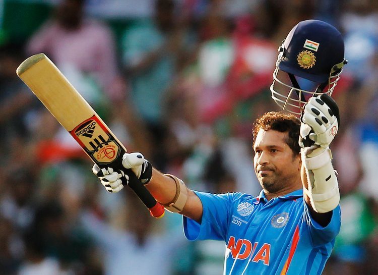 NAGPUR, INDIA - MARCH 12:  Sachin Tendulkar of India raises his bat on scoring his century during the Group B ICC World Cup Cricket match between India and South Africa at Vidarbha Cricket Association Ground on March 12, 2011 in Nagpur, India.  (Photo by Daniel Berehulak/Getty Images)