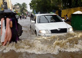 Chennai: Vehicles wade through a water logged street following heavy rains  in Chennai on Saturday. PTI Photo by R Senthil Kumar(PTI10_31_2015_000282a)