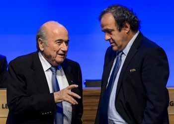 FILES - A picture taken on June 11, 2014 shows FIFA president Joseph Blatter talking to UEFA president Michel Platini during the 64th FIFA congress in Sao Paulo, on the eve of the opening match of the 2014 FIFA World Cup in Brazil. Embattled FIFA chief Joseph Blatter is suspected of "disloyal payment" to UEFA head Michel Platini, who had hoped to succeed him, the office of Switzerland's attorney general said on September 25, 2015.  AFP PHOTO / FABRICE COFFRINIFABRICE COFFRINI/AFP/Getty Images