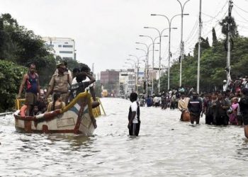 Chennai: People rescue from their Watter lodged houses during heavy rains in Chennai on Wednesday. PTI Photo (PTI12_2_2015_000351A)