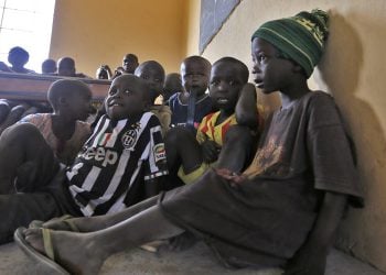 Children displaced as a result of Boko Haram attack in the northeast region of Nigeria, attend a class at Maikohi secondary school camp for internally displaced persons (IDP) in Yola, Adamawa State January 13, 2015. Boko Haram says it is building an Islamic state that will revive the glory days of northern Nigeria's medieval Muslim empires, but for those in its territory life is a litany of killings, kidnappings, hunger and economic collapse. Picture taken January 13, 2015. To match Insight NIGERIA-BOKOHARAM/     REUTERS/Afolabi Sotunde (NIGERIA - Tags: CIVIL UNREST SOCIETY EDUCATION) - RTR4M2ST