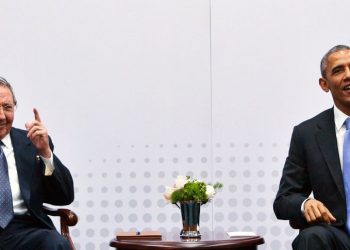 Cuba's President Raul Castro (L) gestures in response to a reporter's question during a meeting with US President Barack Obama (R) on the sidelines of the Summit of the Americas at the ATLAPA Convention center on April 11, 2015 in Panama City. AFP PHOTO/MANDEL NGAN        (Photo credit should read MANDEL NGAN/AFP/Getty Images)