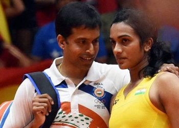 Rio de Janeiro: India's Pusarla V Sindhu with coach Pullela Gopichand after she lost against Spain's Carolina Marin in women's Singles final at the 2016 Summer Olympics at Rio de Janeiro in Brazil on Friday. PTI Photo by Atul Yadav (PTI8_19_2016_000310b)