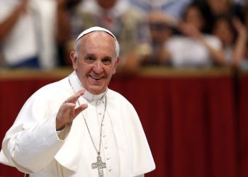 Pope Francis waves to faithful as he arrives at the end of a Mass celebrated by Brescia's Bishop Luciano Monari, not pictured, in St. Peter's Basilica at the Vatican, Saturday, June 22, 2013. (AP Photo/Riccardo De Luca)