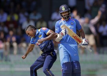 Sri Lanka's Vishwa Fernando, left, celebrates the dismissal of India's Shikhar Dhawan, right, during their fourth one-day international cricket match in Colombo, Sri Lanka, Thursday, Aug. 31, 2017. (AP Photo/Eranga Jayawardena)