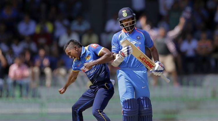 Sri Lanka's Vishwa Fernando, left, celebrates the dismissal of India's Shikhar Dhawan, right, during their fourth one-day international cricket match in Colombo, Sri Lanka, Thursday, Aug. 31, 2017. (AP Photo/Eranga Jayawardena)