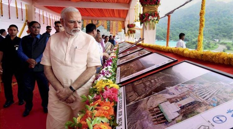 Narmada: Prime Minister Narendra Modi overviews the construction work of Statue of Unity after inaugurating the Sardar Sarovar Dam at Kevadiya in Narmada district on Sunday. PTI Photo / PIB    (PTI9_17_2017_000054B) *** Local Caption ***