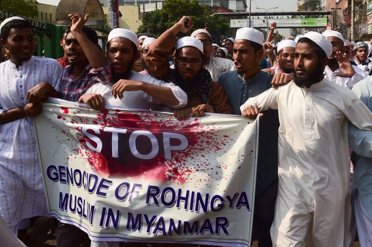 Bangladeshi activists from an Islamic organisation protest against the treatment of Rohingya Muslims in Myanmar, in Dhaka on December 1, 2016
Thousands of desperate Rohingya, a stateless ethnic group, have flooded over the border into Bangladesh in the last few days, bringing with them horrifying stories of gang rape, torture and the systematic killing of their ethnic group. / AFP / Munir UZ ZAMAN        (Photo credit should read MUNIR UZ ZAMAN/AFP/Getty Images)