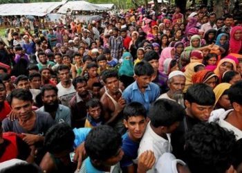 Rohingya refugees gather to collect relief at the Balukhali Makeshift Refugee Camp as they are affected by Cyclone Mora in Cox’s Bazar, Bangladesh May 31, 2017. REUTERS/Mohammad Ponir Hossain