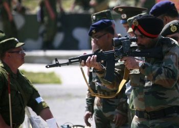 An Indian army officer aims a Russian assault rifle while visiting a range outside the Russian city of Vladikavkaz, July 28, 2010. An Indian army delegation arrived in preparation of a joint Russia-India military drill planned later this year.  REUTERS/Kazbek Basayev    (RUSSIA - Tags: MILITARY POLITICS) - RTR2GTKB