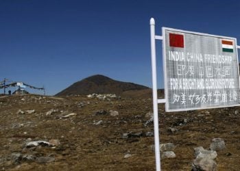 A signboard is seen from the Indian side of the Indo-China border at Bumla, in the northeastern Indian state of Arunachal Pradesh, November 11, 2009. With ties between the two Asian giants strained by a flare-up over their disputed boundary, India is fortifying parts of its northeast, building new roads and bridges, deploying tens of thousands more soldiers and boosting air defences. Picture taken November 11, 2009.   REUTERS/Adnan Abidi (INDIA POLITICS MILITARY) - RTXQO7W