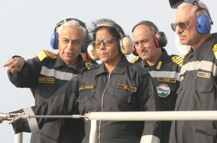 The Chief of Naval Staff, Admiral Sunil Lanba explaining take-off procedure of MiG 29K carrier-borne fighter aircraft to the Union Minister for Defence, Smt. Nirmala Sitharaman  while witnessing the operational manoeuvres of the Western Fleet ships, conducted by the Indian Navy, on January 08, 2018.