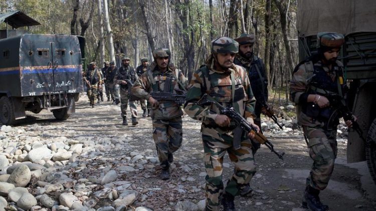Indian army soldiers patrol near the site of a gunbattle with suspected rebels in Bungham village, northwest of Srinagar, Indian controlled Kashmir, Wednesday, Oct. 21, 2015. Indian government forces killed a suspected rebel in a gunbattle Wednesday in the disputed Himalayan region of Kashmir, officials said. (AP Photo/Dar Yasin)