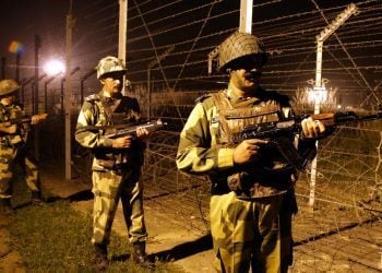 epa05567621 A picture made available on 03 October 2016 shows Indian Border Security Force (BSF) soldiers standing guard during a night patrol near the fence at the India-Pakistan International Border at the outpost of Akhnoor sector, about 40 km from Jammu, the winter capital of Kashmir, India, 02 October 2016. BSF soldiers are on high alert along the international border in Jammu, after India conducted surgical strikes across the LoC (Line of Control) on 29 September. Director General of Military Operations (DGMO) in New Delhi, Lt. Gen. Ranbir Singh, said that significant damage has been caused to militants and to those who tried to shield them.  EPA/JAIPAL SINGH