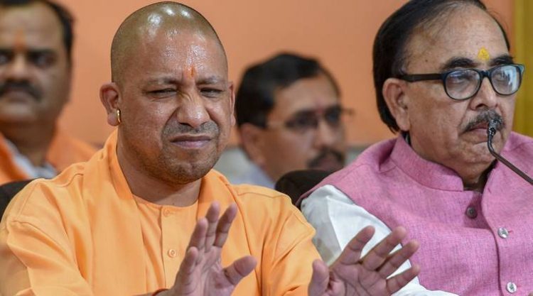 Lucknow: Uttar Pradesh Chief Minister Yogi Adityanath addresses a press conference on completion of four years of Narendra Modi government at the Centre, at the party office in Lucknow on Saturday. (PTI Photo/Nand Kumar) (PTI5_26_2018_000119A)