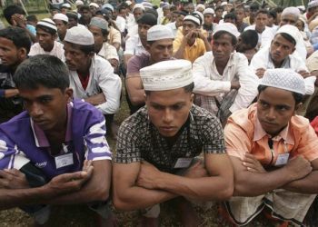 "Rohingya boat people wait for their breakfast at a temporary shelter in the Idi Rayeuk district of Indonesia's Aceh province in this February 5, 2009 file photo. Ethnic strife between a tiny Muslim minority and the Buddhist majority threatens to undo the reforms by the new civilian government." *** Local Caption *** "Rohingya boat people wait for their breakfast at a temporary shelter in the Idi Rayeuk district of Indonesia's Aceh province in this February 5, 2009 file photo. Ethnic strife between a tiny Muslim minority and the Buddhist majority threatens to undo the reforms by the new civilian government.   To match Special Report MYANMAR-ROHINGYA. REUTERS"