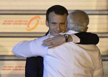 NEW DELHI, INDIA - MARCH 9: Prime Minister Narendra Modi welcomes French President Emmanuel Macron and his wife Brigitte Macron at AFS Palam on March 9, 2018 in New Delhi, India.  The visit is also aimed at strengthening the bilateral economic, political and strategic dimension of our engagement, the MEA said in a statement. The last visit of the French President to India was in January 2016, when Macron was the chief guest at the Republic Day celebrations. Prime Minister Modi had last visited France in June last year. (Photo by Vipin Kumar/Hindustan Times via Getty Images)