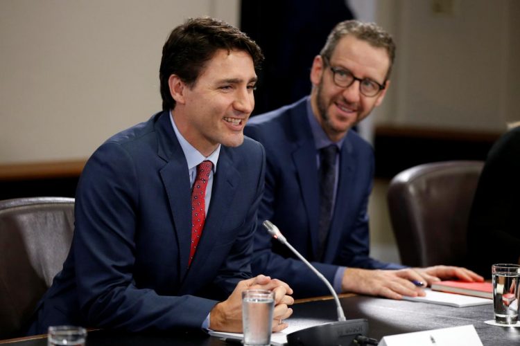 FILE PHOTO: Canada's Prime Minister Justin Trudeau (L) and his principal secretary Gerald Butts take part in a meeting with Italy's Prime Minister Paolo Gentiloni (not pictured) on Parliament Hill in Ottawa, Ontario, Canada, April 21, 2017. REUTERS/Chris Wattie