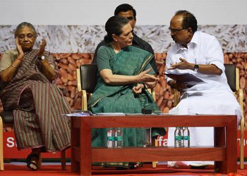 Chairperson of the United Progressive Alliance, Sonia Gandhi (L) speaks with India's Food Minister K.V. Thomas (R) during the launch of a subsidised food program in New Delhi on August 20.  The controversial program has not been approved by the Indian congress yet but if approved it would provide cheap grain to some 800 million of Indian citizens.     AFP PHOTO/Roberto SCHMIDT        (Photo credit should read ROBERTO SCHMIDT/AFP/Getty Images)
