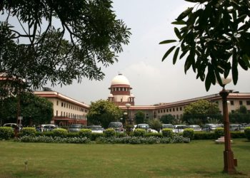 View Of Indian Supreme court main building from the supreme court lawn In New Delhi .