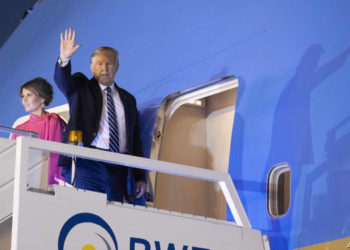 U.S.President Donald Trump, and first lady Melania Trump, wave as board Air Force One upon departure from at Indian Air Force Palam airport, Tuesday, Feb. 25, 2020, in New Delhi, India. (AP Photo/Alex Brandon)