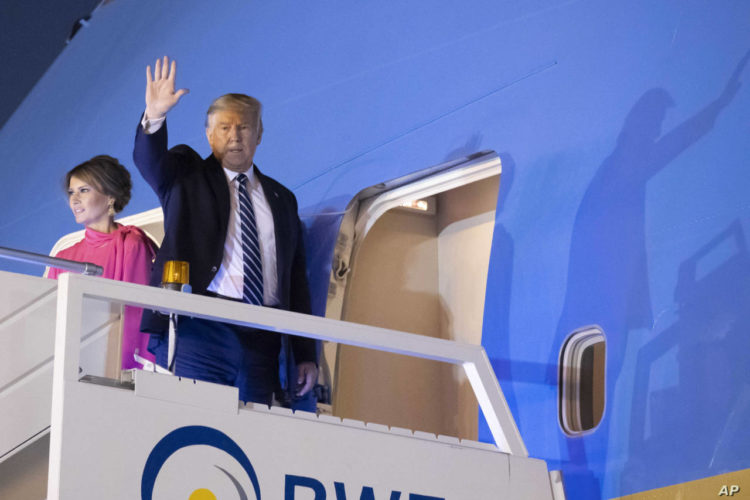 U.S.President Donald Trump, and first lady Melania Trump, wave as board Air Force One upon departure from at Indian Air Force Palam airport, Tuesday, Feb. 25, 2020, in New Delhi, India. (AP Photo/Alex Brandon)