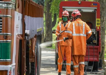 Wayanad: Firefighters sanitize a truck during a nationwide lockdown in the wake of coronavirus outbreak, in Wayanad, Saturday, April 18, 2020. (PTI Photo)(PTI18-04-2020_000175B)