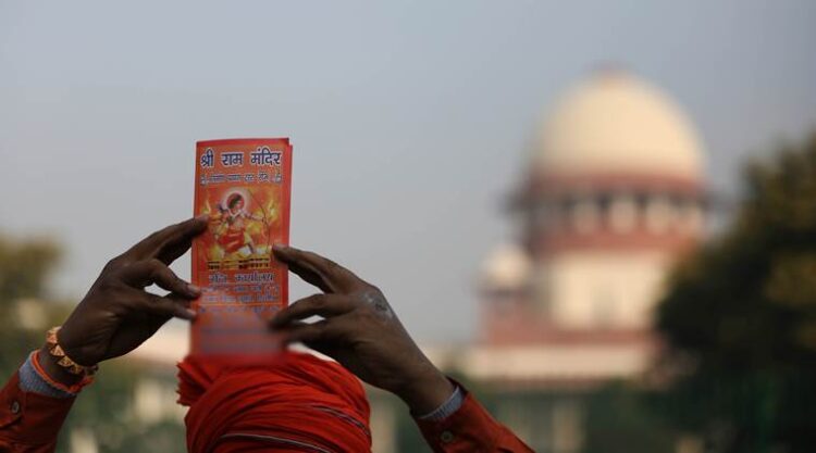 Supporters of the Temple  at the Supreme Court in New Delhi , where the heairng in the Ayodhya Babri case was underway on thursday. Express Photo by Tashi Tobgyal New Delhi 100119