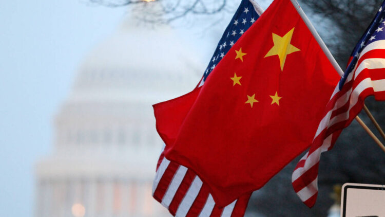 The People's Republic of China flag and the U.S. Stars and Stripes fly along Pennsylvania Avenue near the U.S. Capitol in Washington during Chinese President Hu Jintao's state visit, January 18, 2011. Hu arrived in the United States on Tuesday for a state visit with U.S. President Barack Obama that is aimed at strengthening ties between the world's two biggest economies. REUTERS/Hyungwon Kang (UNITED STATES - Tags: POLITICS)